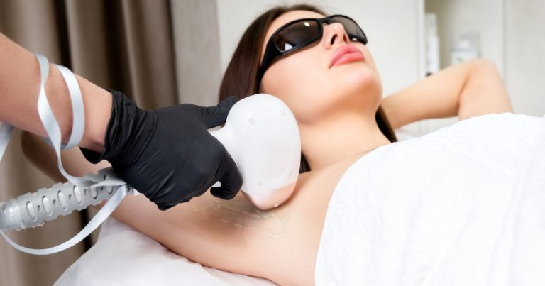 a woman receiving a cosmetic hair-removal treatment.